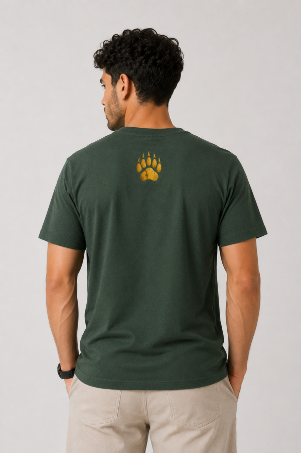 The upper back of the lightweight forest green t-shirt featuring the signature five-claw gold paw logo.