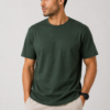 A male model looking to the side showcasing the front fit of our premium lightweight forest green t-shirt.
