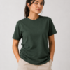 A female model posing with hands in her pockets wearing the stylish lightweight forest green t-shirt.