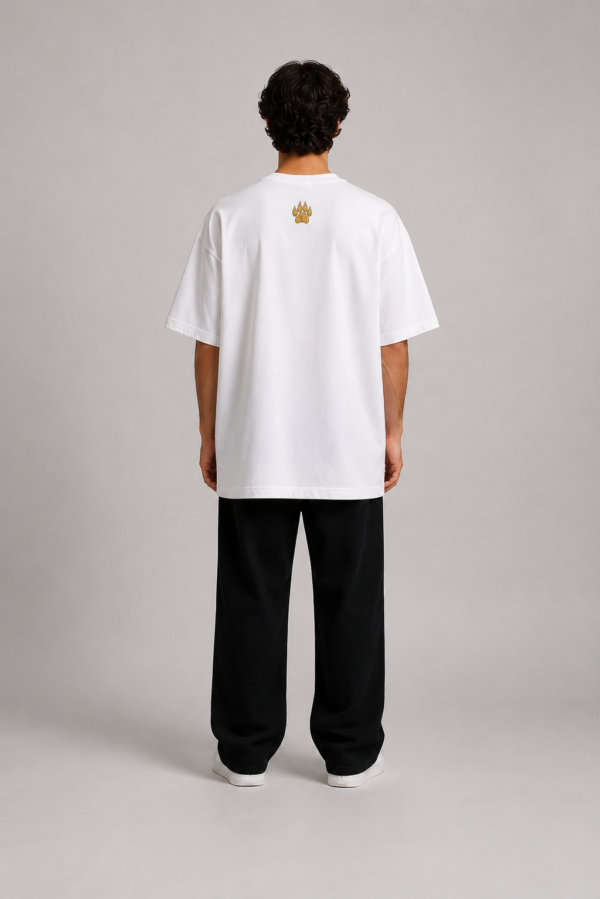 TAP White Oversized Tee – Gold Paw Logo Back (Men's) Back of TAP white oversized t-shirt showing gold paw logo between the shoulders on a male model