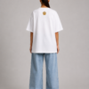 TAP White Oversized Tee – Gold Paw Logo Back (Women's) Back of TAP white oversized tee with gold paw logo on the upper back, female model