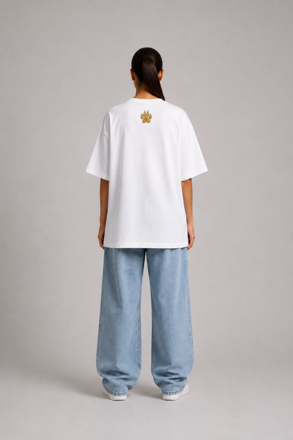 TAP White Oversized Tee – Gold Paw Logo Back (Women's) Back of TAP white oversized tee with gold paw logo on the upper back, female model