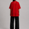 TAP Red Oversized Tee – Gold Paw Logo Back (Women's) Back of TAP red oversized tee with gold paw logo on the upper back, female model
