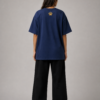 TAP Navy Oversized Tee – Gold Paw Logo Back (Women's) Back of TAP navy oversized tee with gold paw logo on the upper back, female model