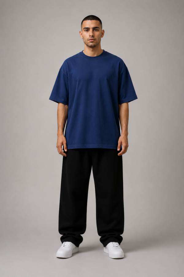 TAP Navy Oversized T-Shirt – Men's Front Man wearing TAP navy oversized t-shirt, plain front, unisex oversized fit
