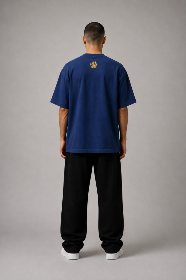 TAP Navy Oversized Tee – Gold Paw Logo Back (Men's) Back of TAP navy oversized tee with gold paw logo between the shoulders, male model